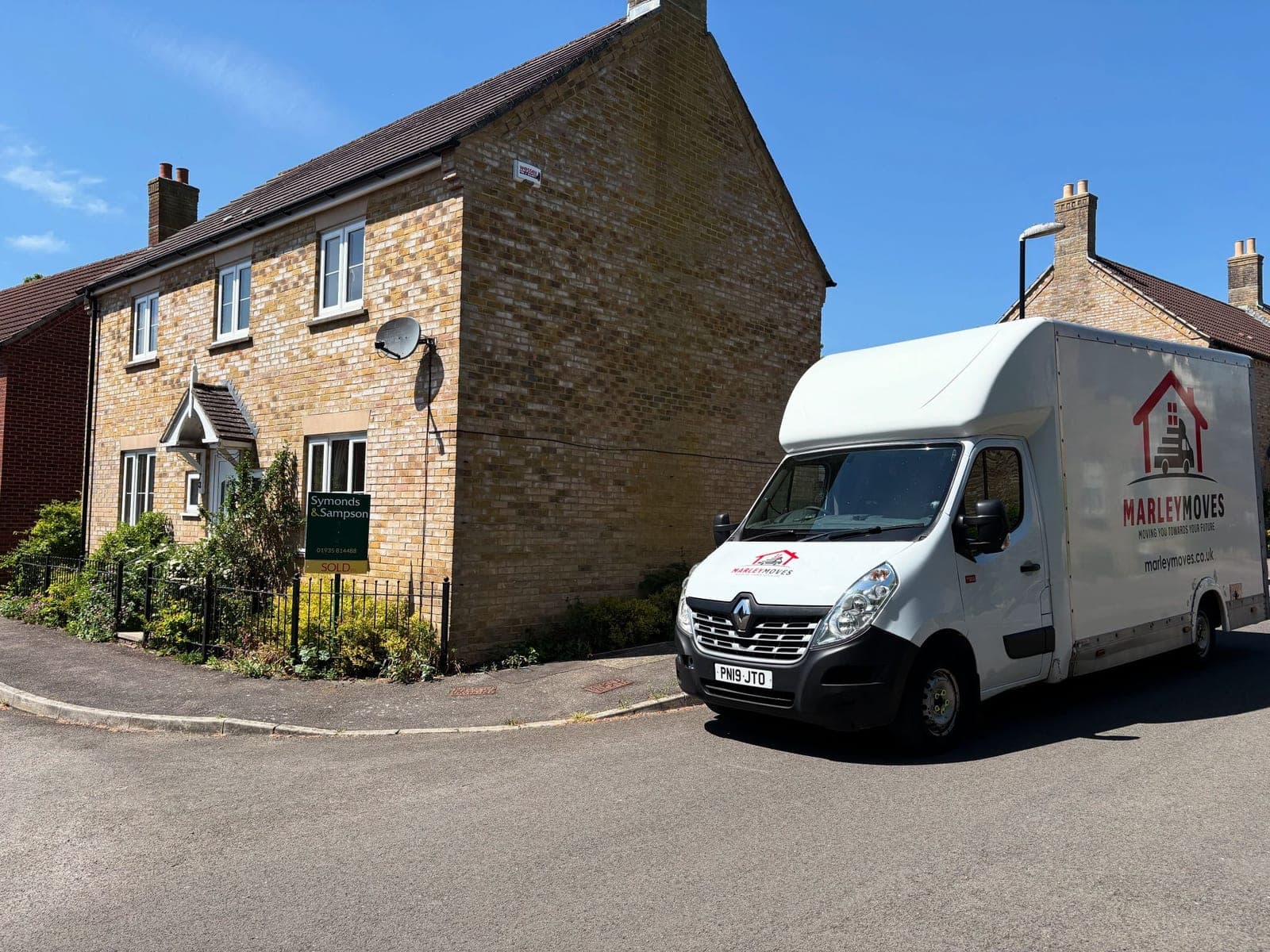 Marley Moves branded Luton van parked at the side of a customer's house in the Dorset sunshine, the in-house team that flexes when a removal date or scope shifts at the last minute