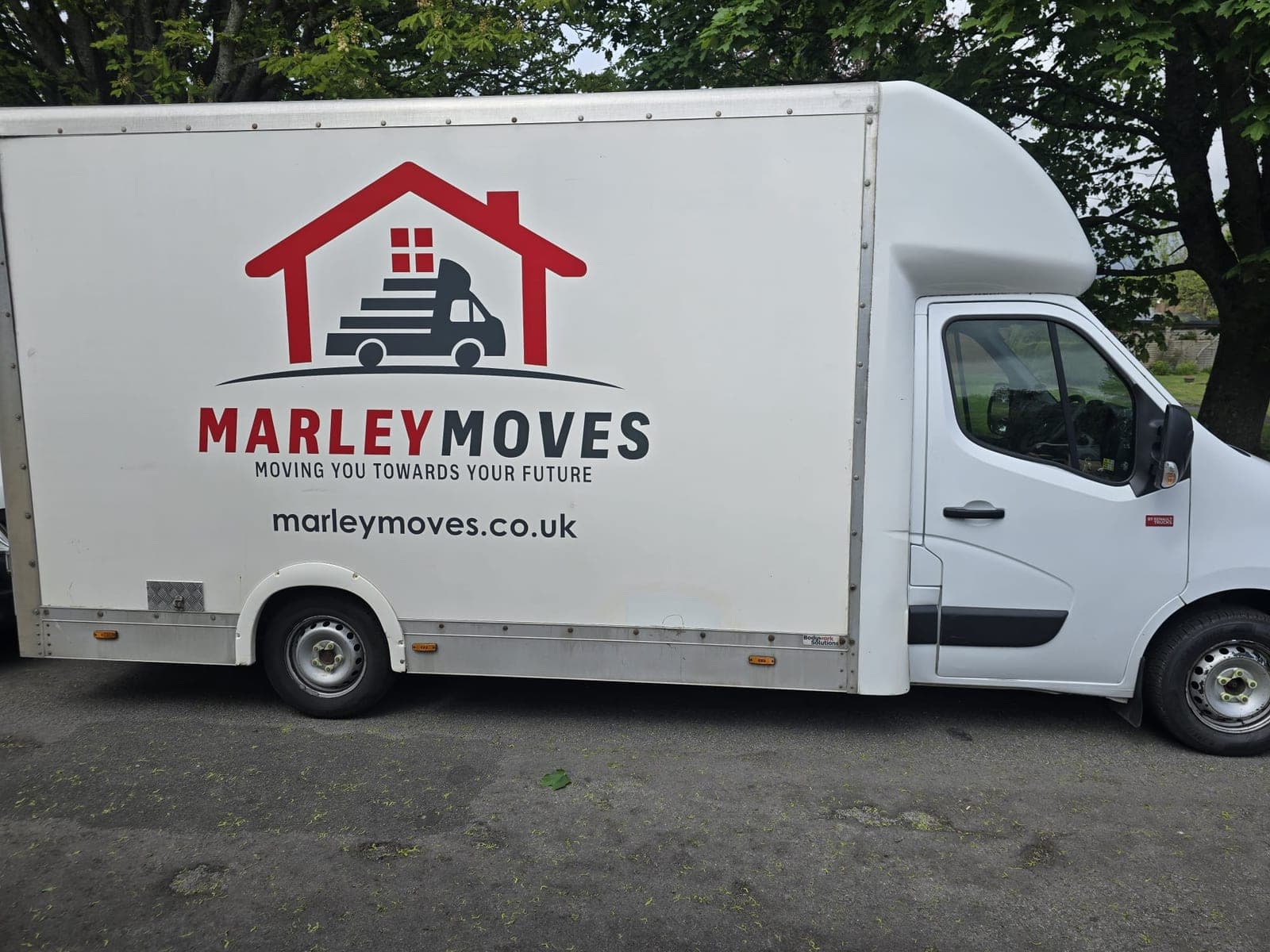 Single Marley Moves branded Luton van parked outside, the full Marley Moves logo lockup visible on the side panel, the man-and-van service compared to a full removal